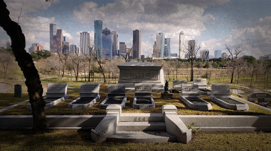 Founders Memorial Cemetery, one of the haunted places in Houston, features several tombstones in the foreground against a city skyline under a cloudy sky.