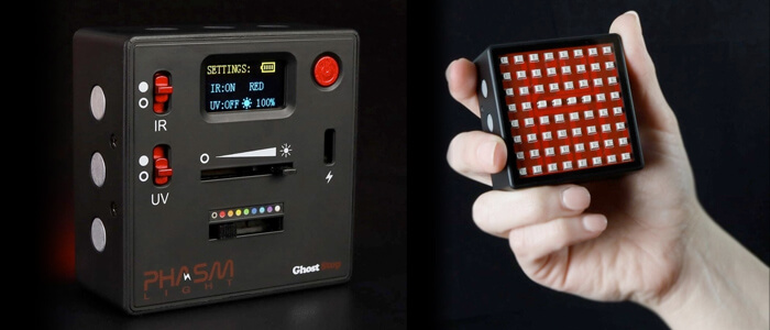 Close-up of two pieces of ghost hunting equipment. The left one displays settings on a small screen and has buttons and sliders, labeled "IR," "UV," and others. The right one, known as the Phasm Light, is a handheld device with a grid of red lights.